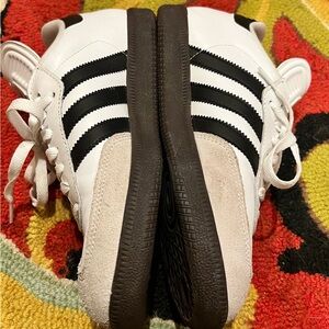 Samba white and black tennis shoe.